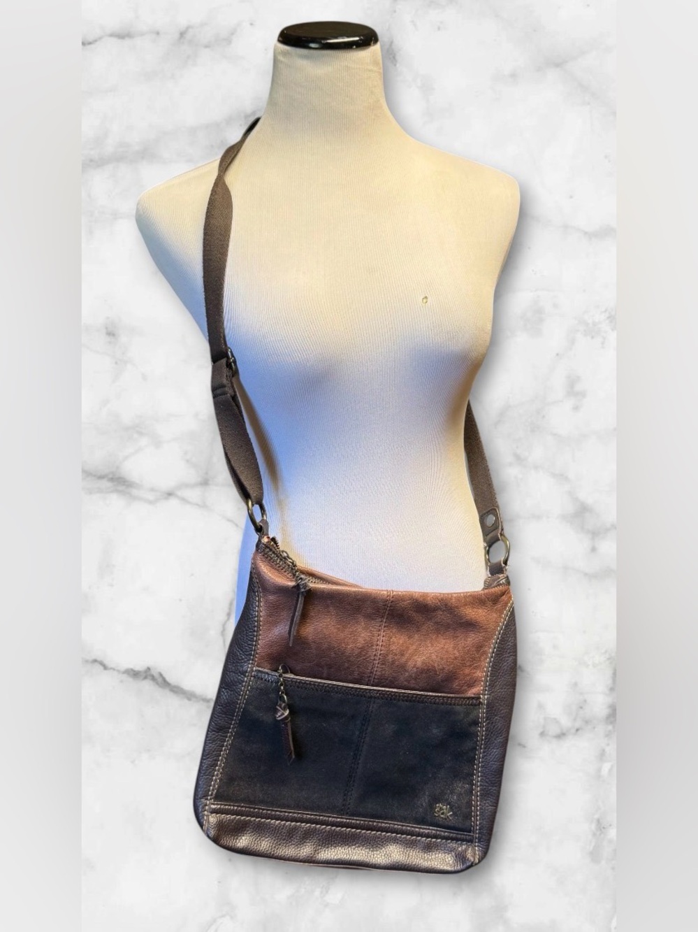 The Sak Iris leather crossbody bag in a two-tone brown and dark metallic